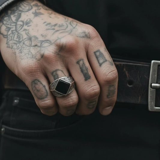 Close-up image of a handcrafted men’s black onyx signet ring made from high-quality 925 sterling silver, featuring bold vintage-inspired engravings, ideal for keywords such as “masculine silver jewelry” and “statement onyx ring gift for him.”