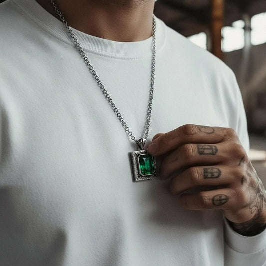 Artisan-made emerald pendant necklace with 925 sterling silver, chunky and durable structure, vintage texture, handcrafted details, and symbolic meaning representing love, renewal, and protection.