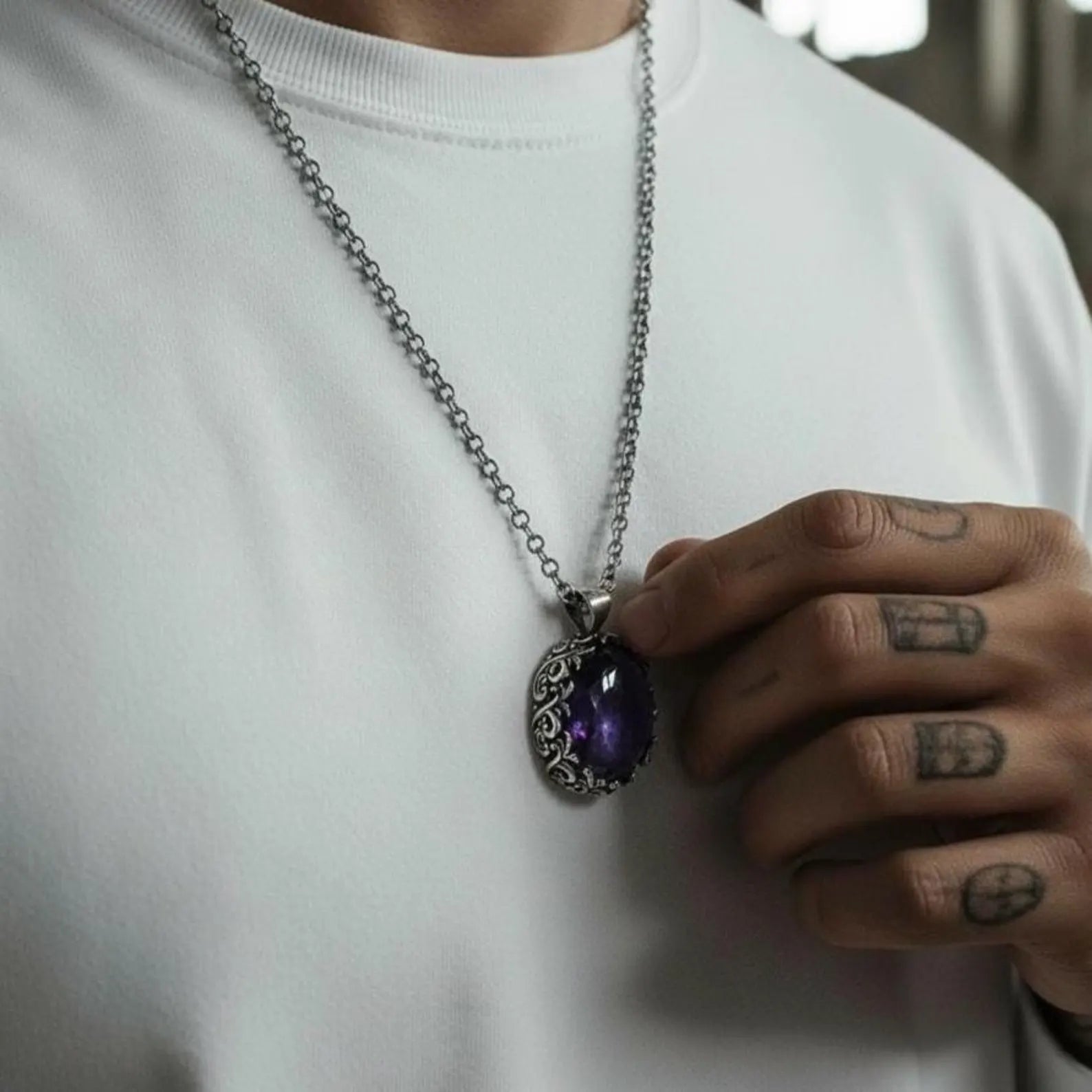 Unisex amethyst silver necklace featuring a deep violet gemstone set in a handcrafted 925 sterling silver pendant with vintage-inspired baroque details, captured in high-resolution for product showcase.