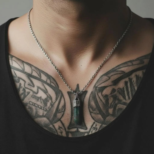 Artisan-made 925 sterling silver compass pendant with natural Moss Agate centerpiece, showcasing unique green patterns and grounding energy, photographed as a premium vintage-inspired men’s gemstone necklace.