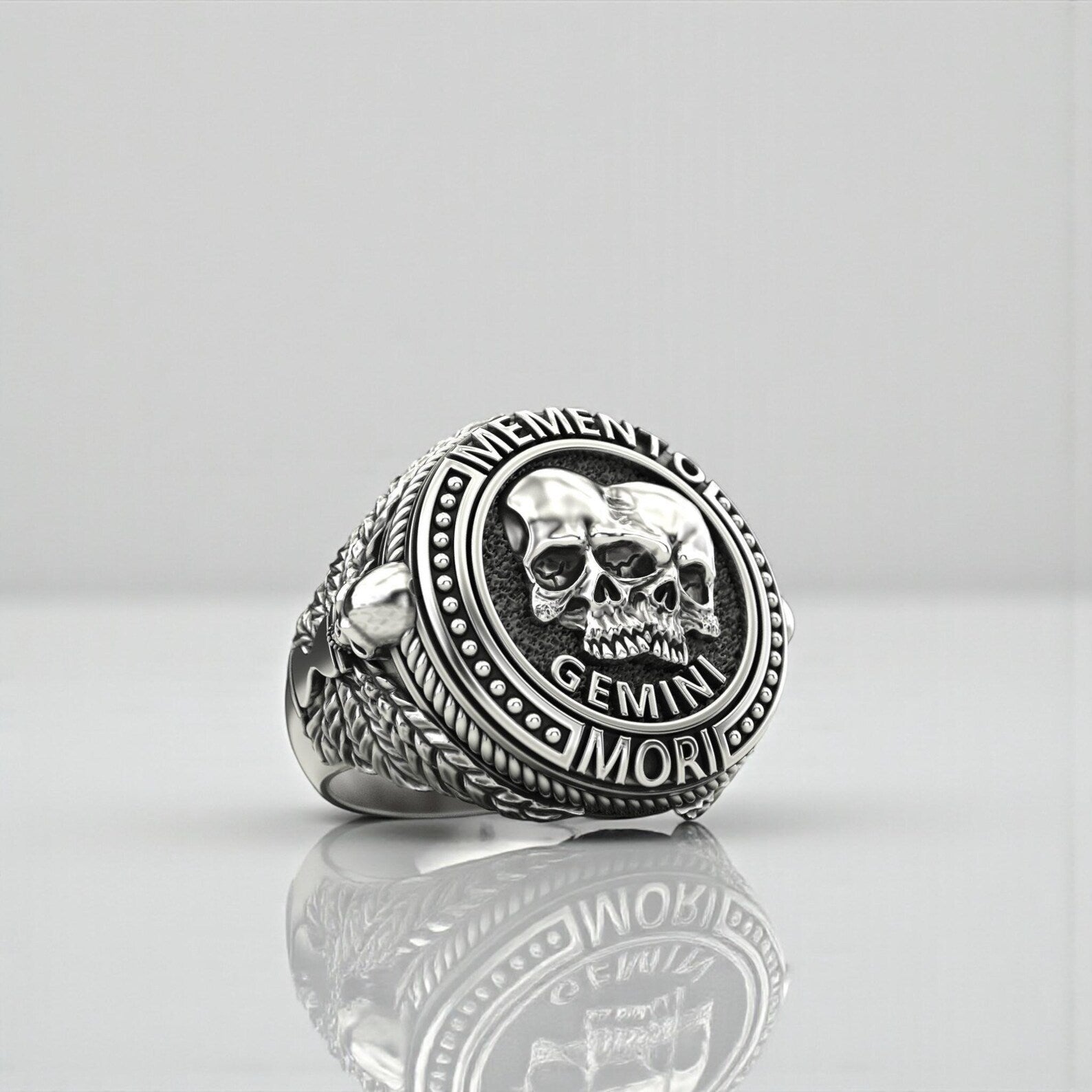 Handmade sterling silver ring with an elaborate Gemini zodiac skull motif inspired by ancient Memento Mori symbolism, crafted with artisanal precision, rich oxidized contrasts, and durable masculine styling ideal for gifting and personal expression.