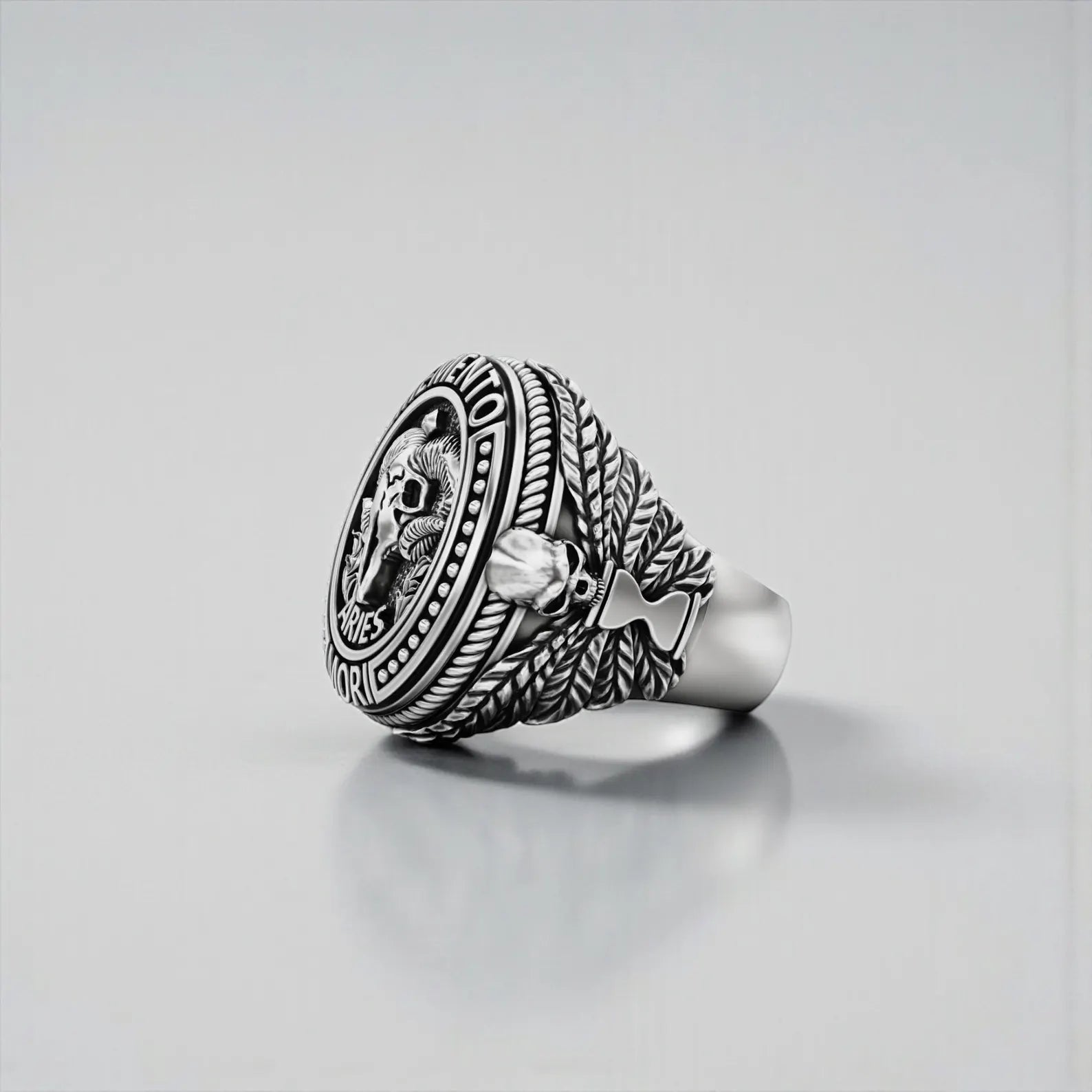 Side angle of handcrafted Aries Memento Mori ring, showing thick silver band, detailed textures, and durable artisan craftsmanship