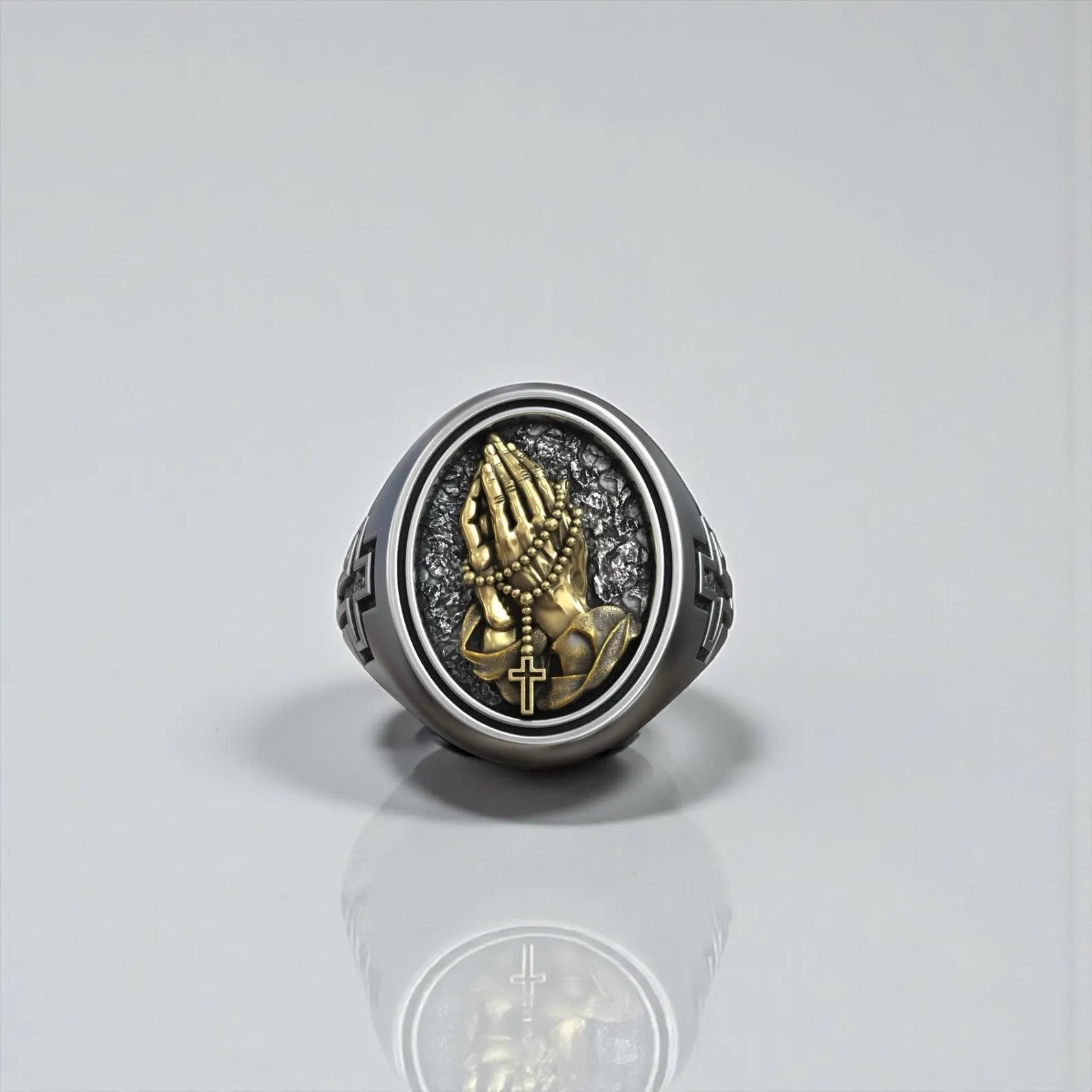 Unique Christian faith ring made from high quality sterling silver, showcasing praying hands, a rosary chain, and a gold highlighted cross in a masculine signet style