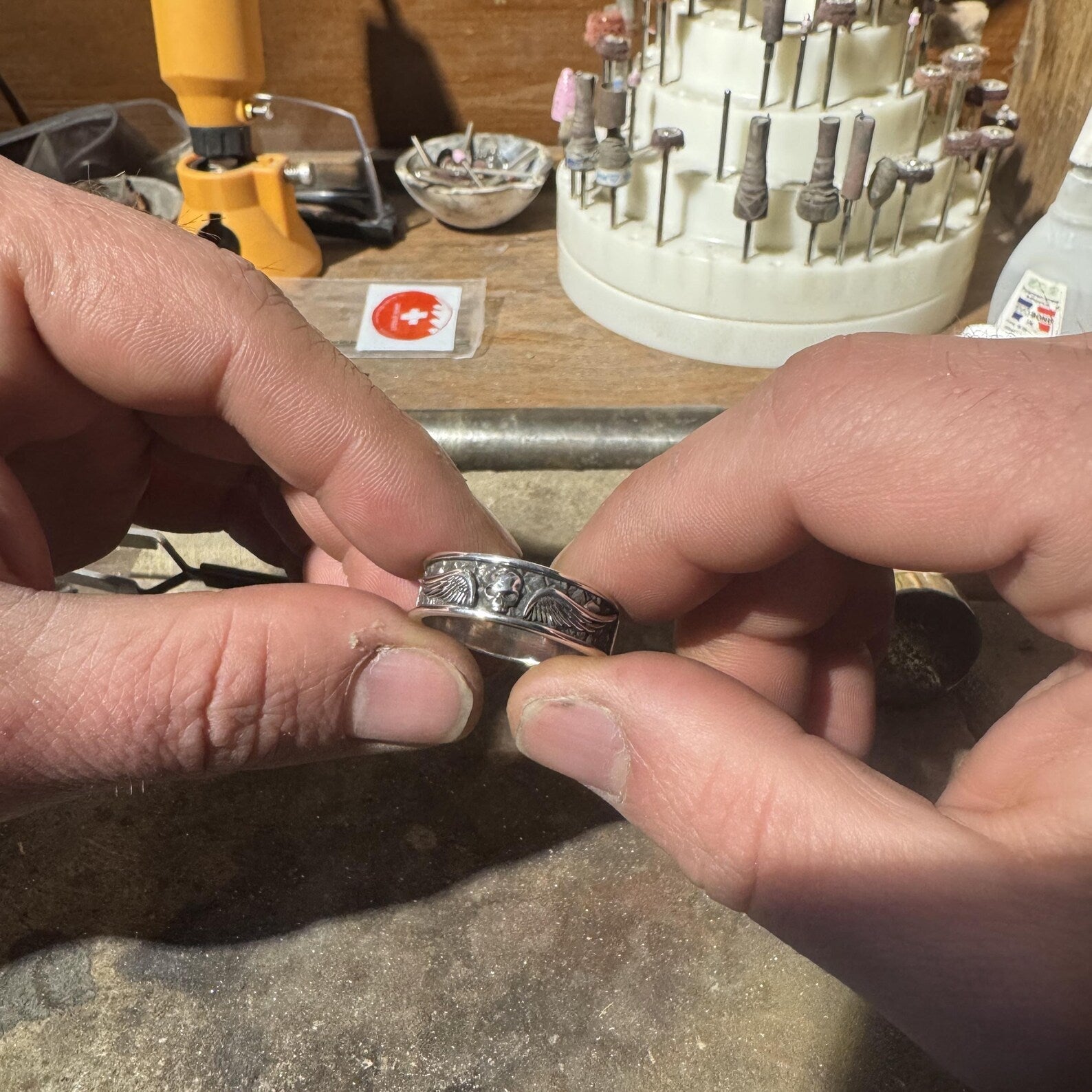 Premium handcrafted skull band ring made from solid sterling silver, fully handmade with precise detailing, representing authentic gothic jewelry and biker ring craftsmanship.