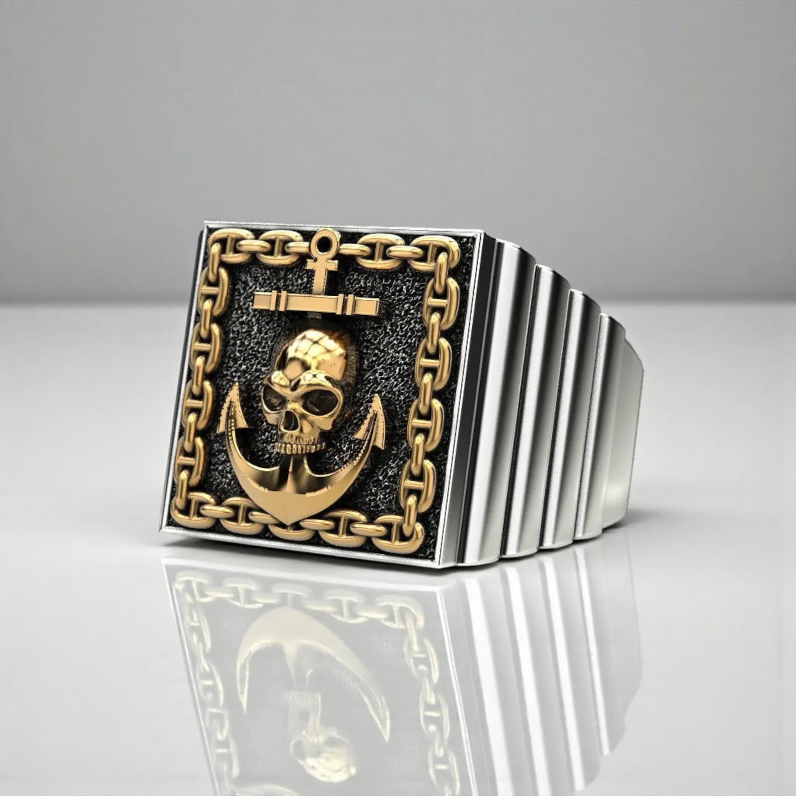 Handcrafted sterling silver skull and anchor pirate ring for men, featuring a detailed nautical design with elegant gold accents inspired by maritime tradition