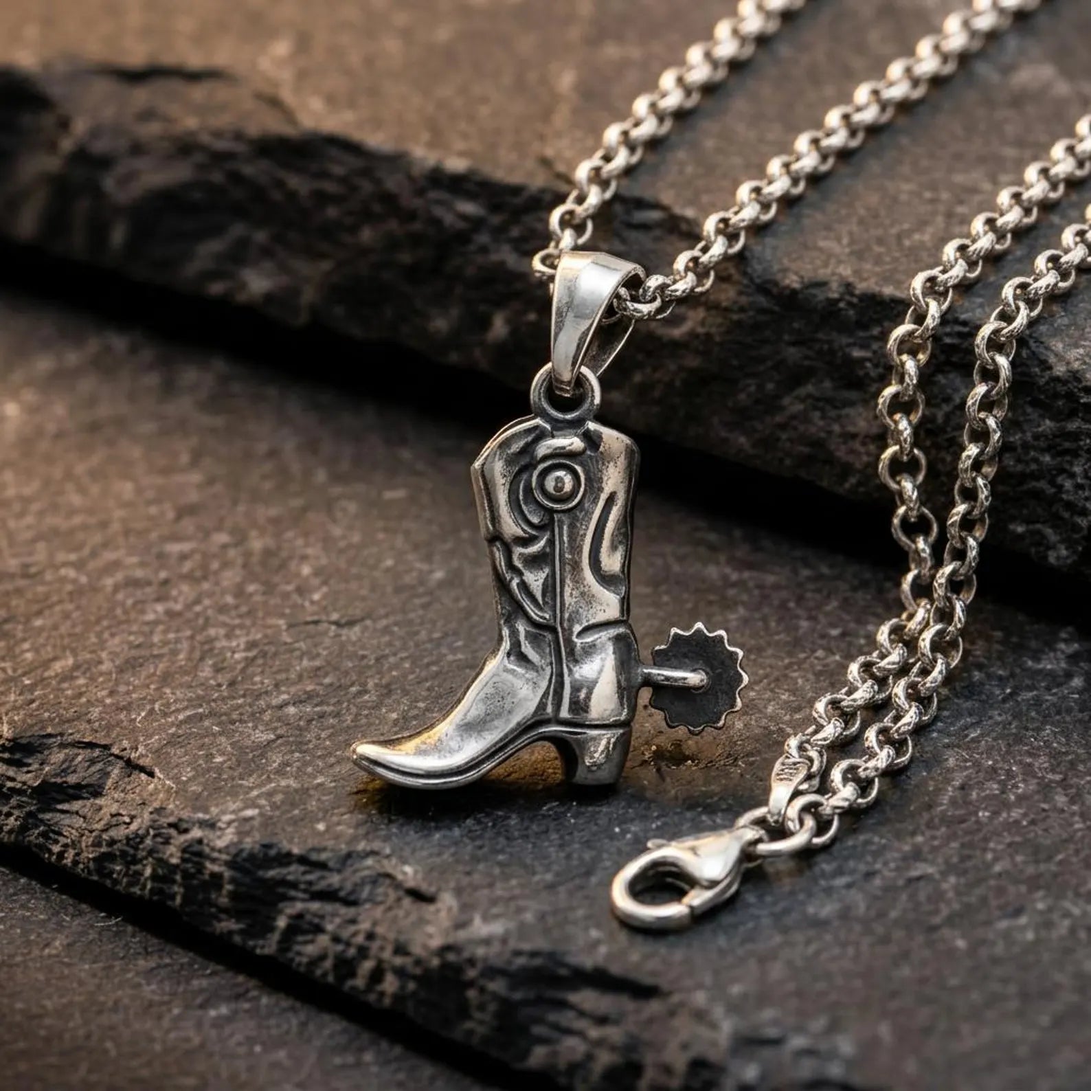 Handmade sterling silver cowboy boot charm inspired by classic rodeo culture and American frontier heritage.