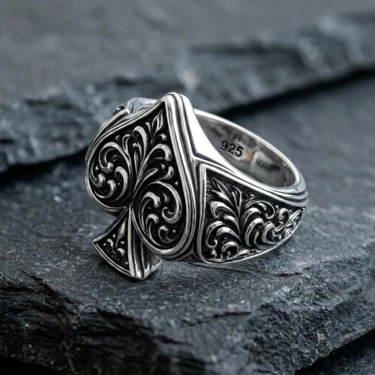 Solid sterling silver Ace of Spades signet ring handcrafted with detailed Gothic engravings and medieval-inspired decorative patterns, creating a timeless poker-themed statement ring for men who appreciate unique artisan jewelry.