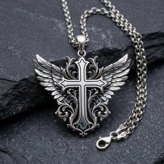 Handcrafted sterling silver Winged Cross pendant necklace featuring intricate Baroque-inspired engravings, detailed angel wings, and an oxidized antique finish, creating a timeless Christian jewelry piece that symbolizes faith, divine protection, hope, and spiritual strength.