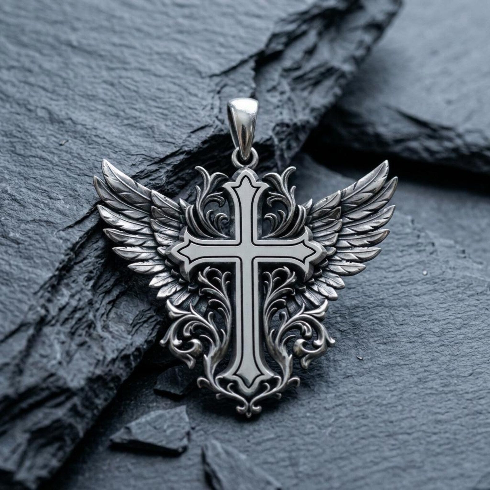 Detailed handcrafted sterling silver Christian Cross necklace displaying elegant angel wings, intricate Baroque floral ornamentation, oxidized antique texture, and premium artisan craftsmanship designed for everyday spiritual expression.