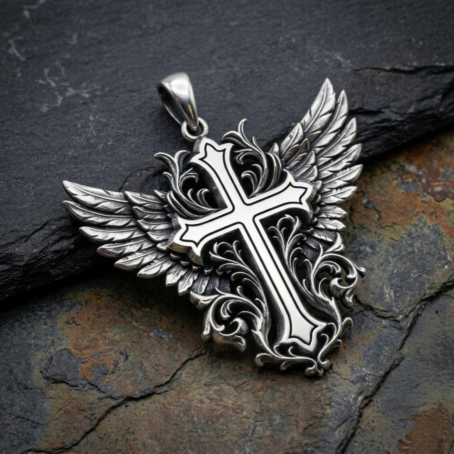 Artisan-crafted 925 sterling silver religious pendant featuring an ornate Winged Cross with decorative Baroque engravings, handcrafted detailing, oxidized vintage finish, and timeless Christian symbolism inspired by classic European artistry.