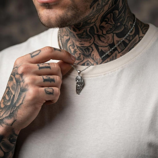 Close-up view of a handcrafted 925 sterling silver Raven Wing pendant showcasing beautifully sculpted feathers, elegant Baroque ornamentation, oxidized vintage detailing, and exceptional artisan craftsmanship inspired by Odin and ancient mythology.