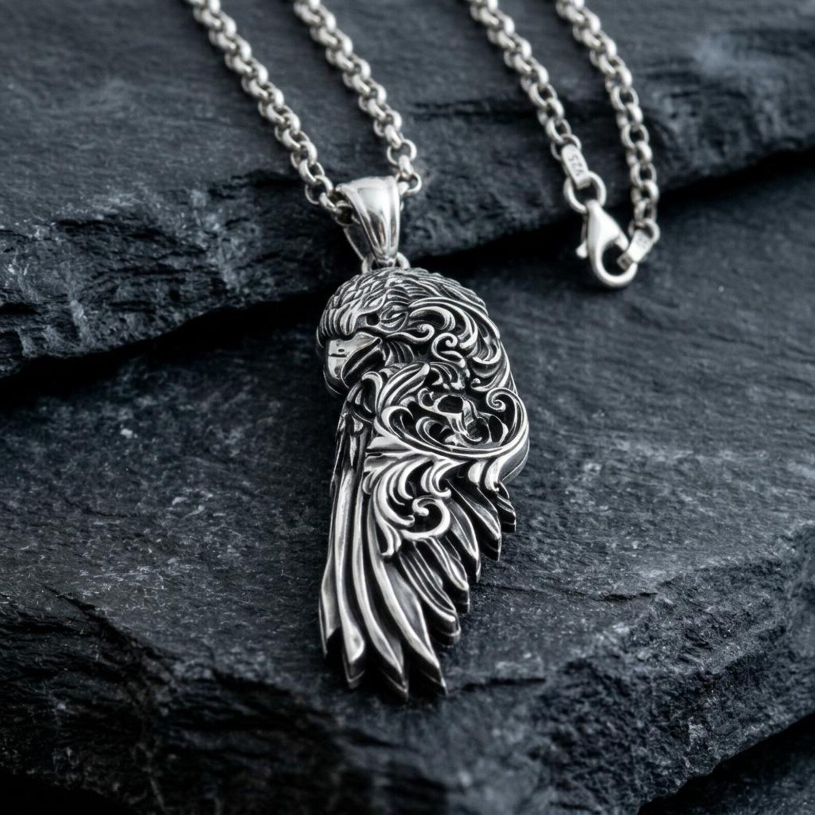 Handcrafted 925 sterling silver Raven Wing pendant featuring beautifully engraved feathers, elegant Baroque scrollwork, antique oxidized texture, and a mythological design inspired by Viking culture and the legendary ravens of Odin.