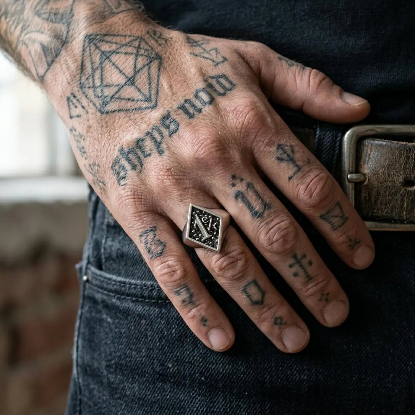 Men's sterling silver biker skull ring inspired by one percenter motorcycle culture, handcrafted with intricate Gothic details and rugged artisan craftsmanship.