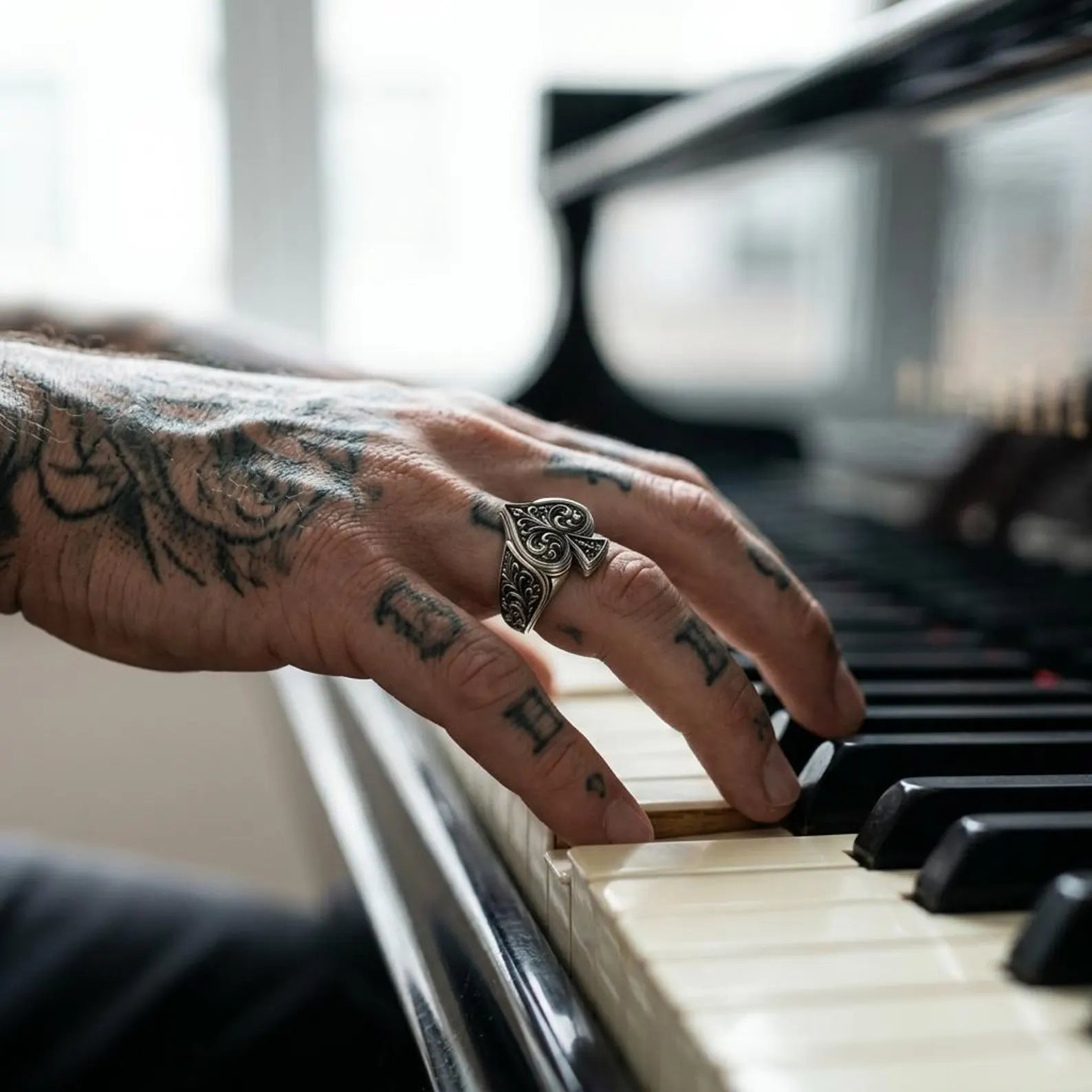 Handmade Gothic Ace of Spades sterling silver ring displaying intricate engraved filigree details, bold medieval ornamentation, and a polished oxidized finish that highlights exceptional handcrafted silversmith craftsmanship.