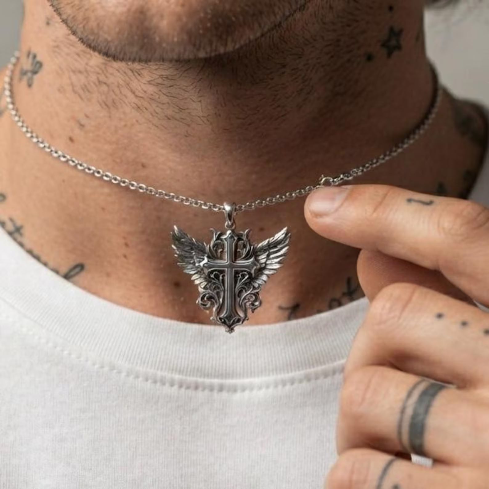 Luxury handcrafted sterling silver Winged Cross pendant with elaborate Baroque ornamentation, detailed angel wings, and antique-inspired oxidized finish, creating a meaningful religious necklace for Christians who appreciate exceptional craftsmanship.