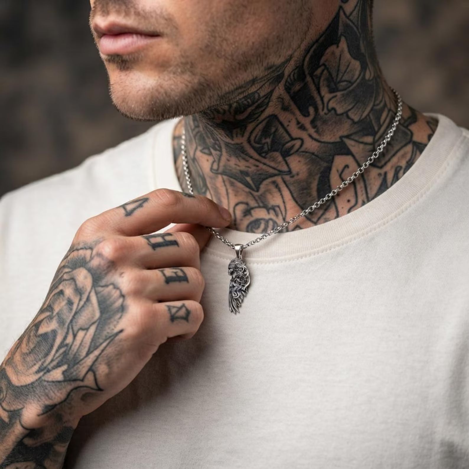 Solid 925 sterling silver Raven Wing pendant handcrafted with intricate Baroque engravings, realistic feather detailing, and an antique oxidized finish inspired by Odin's legendary ravens, Huginn and Muninn, symbols of wisdom and knowledge.