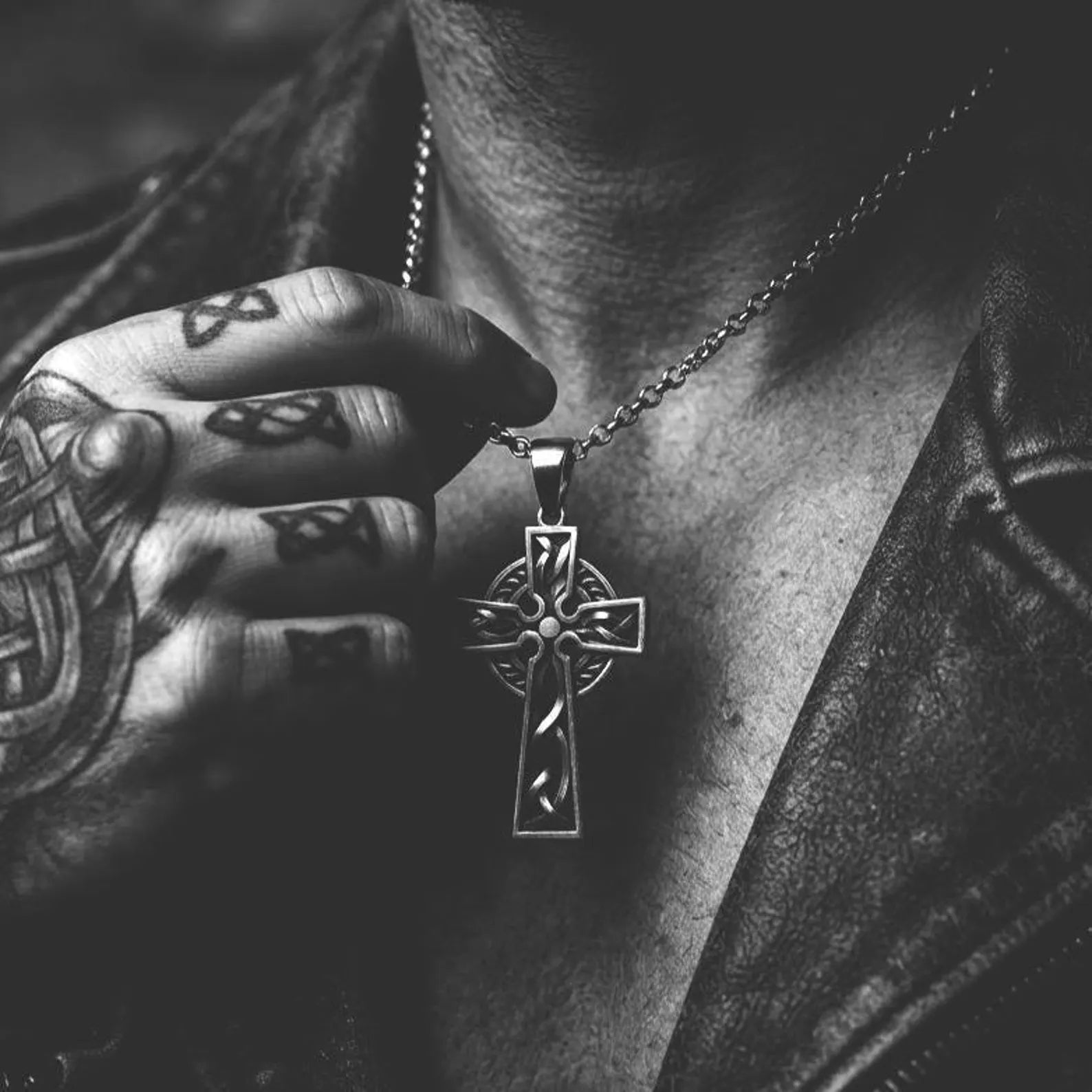 Religious sterling silver cross pendant featuring authentic Celtic knot patterns, handcrafted craftsmanship, and a meaningful expression of Christian faith and devotion.