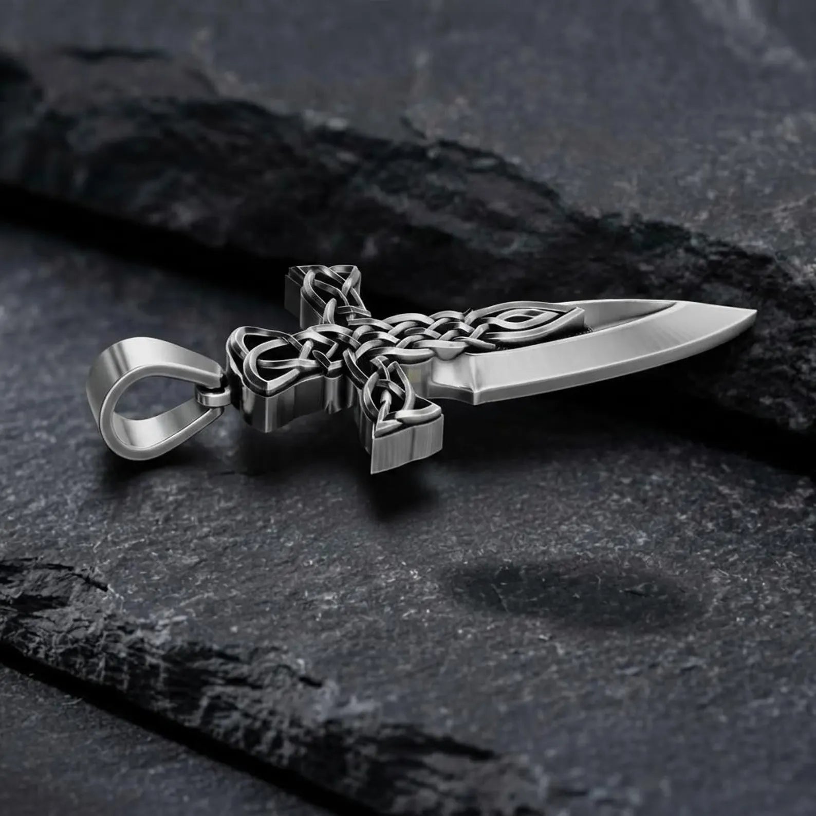 Premium handcrafted sterling silver Celtic Pattern Cross Sword pendant featuring oxidized detailing, traditional Celtic knot designs, and symbolic medieval craftsmanship for men seeking bold spiritual jewelry.