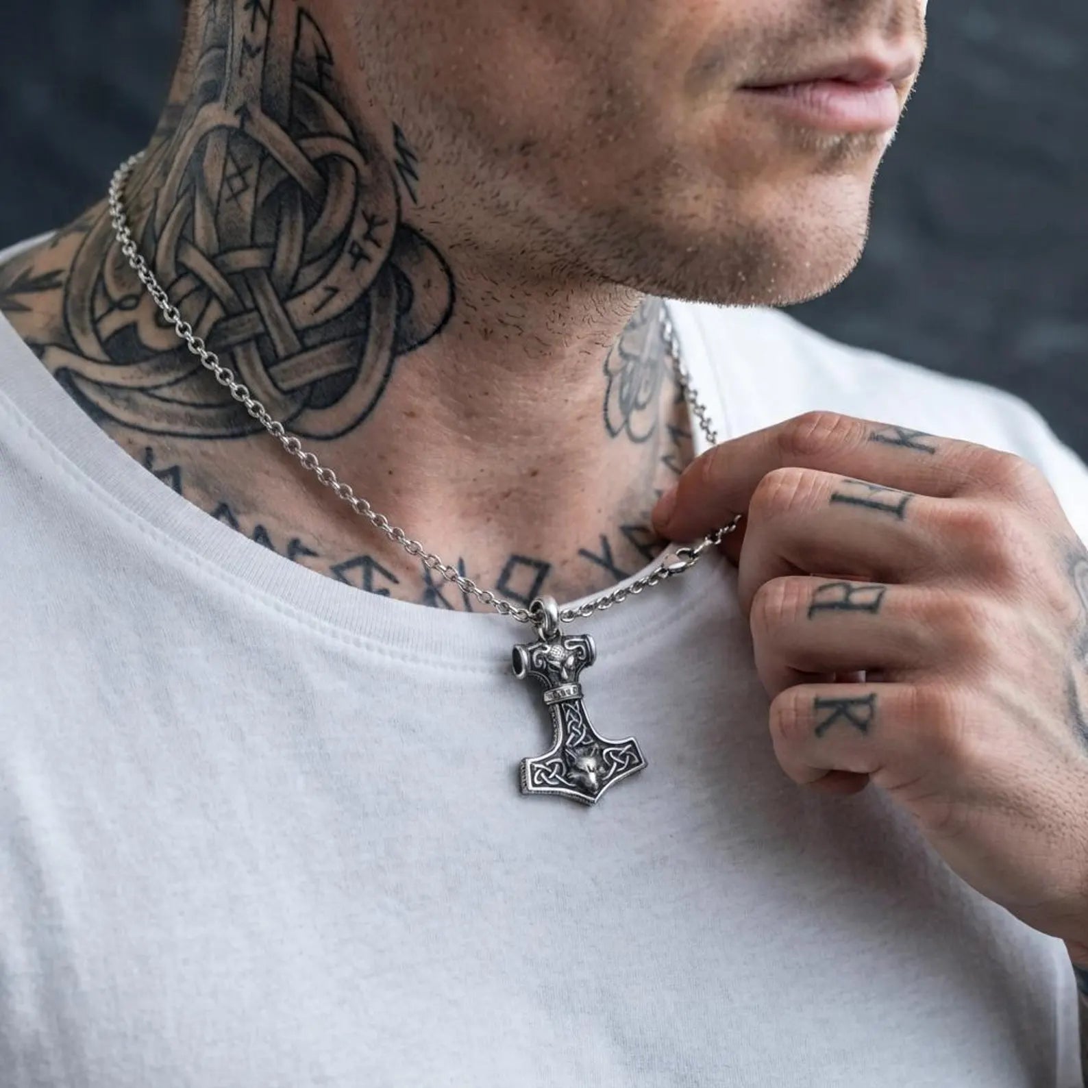 Handcrafted Celtic Wolf Hammer pendant made from solid sterling silver, inspired by Thor's Mjolnir and Norse mythology, with engraved Celtic artwork and rugged medieval styling.