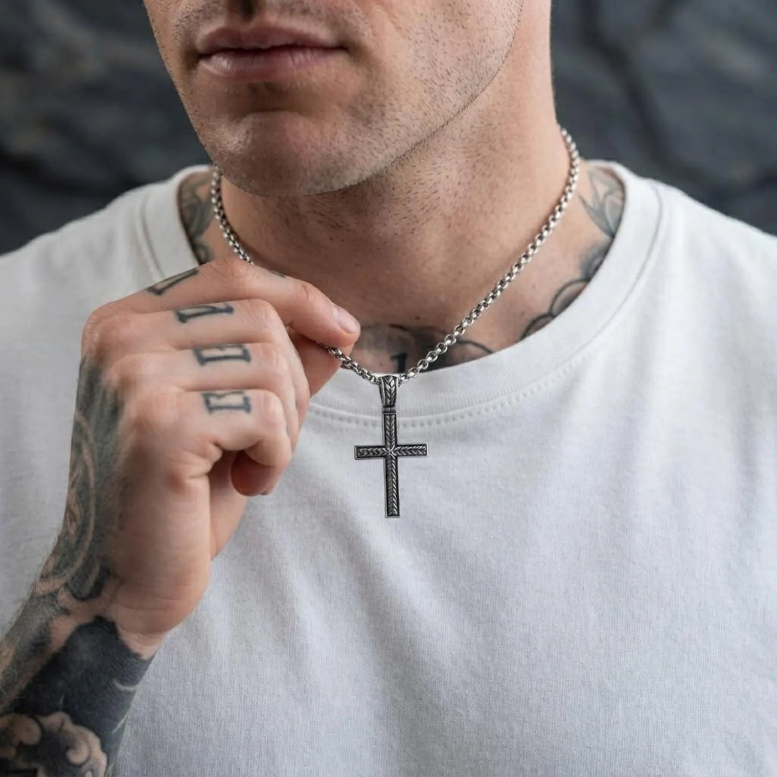 Elegant sterling silver braided cross pendant with detailed woven craftsmanship, creating a meaningful Christian necklace that blends timeless faith with classic masculine style.