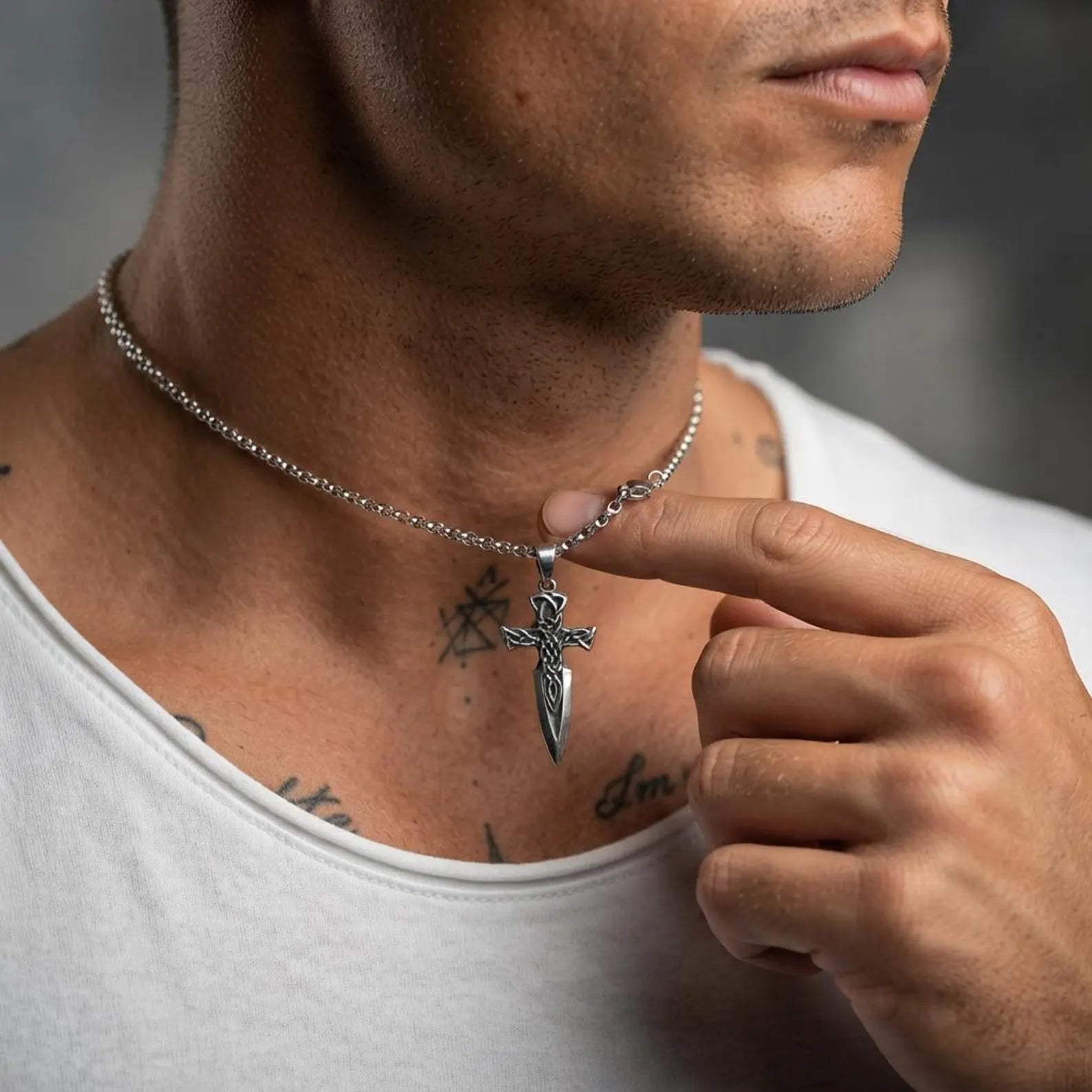 Men's handcrafted sterling silver Celtic Cross Sword pendant featuring ornate Celtic knot engravings, medieval sword symbolism, and a timeless Christian design perfect for everyday wear or special occasions.