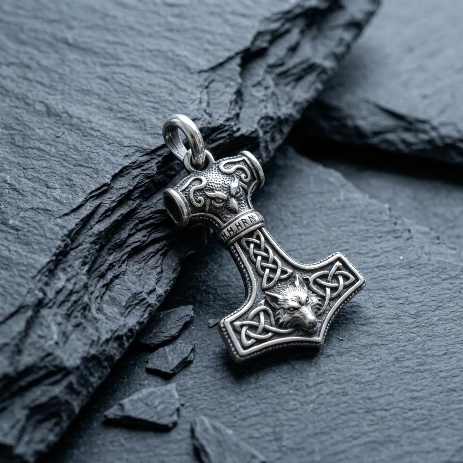 Sterling silver Norse Wolf Hammer necklace combining the legendary Mjolnir symbol with traditional Celtic knotwork, handcrafted to celebrate Viking heritage, courage, and ancient mythology.