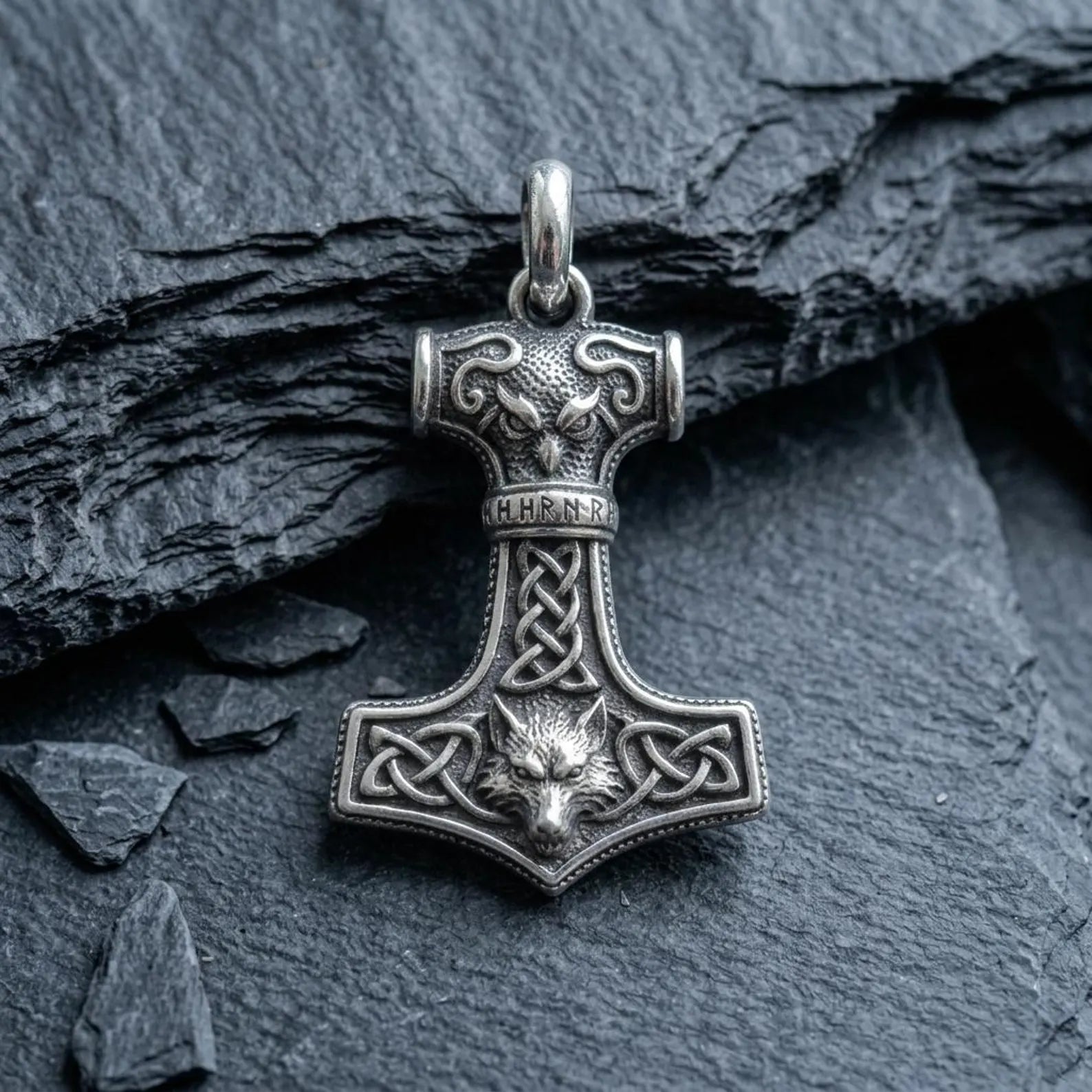 Unique sterling silver Celtic Wolf Hammer necklace inspired by Thor's legendary Mjolnir, featuring detailed wolf symbolism and handcrafted Viking jewelry designed for mythology enthusiasts.