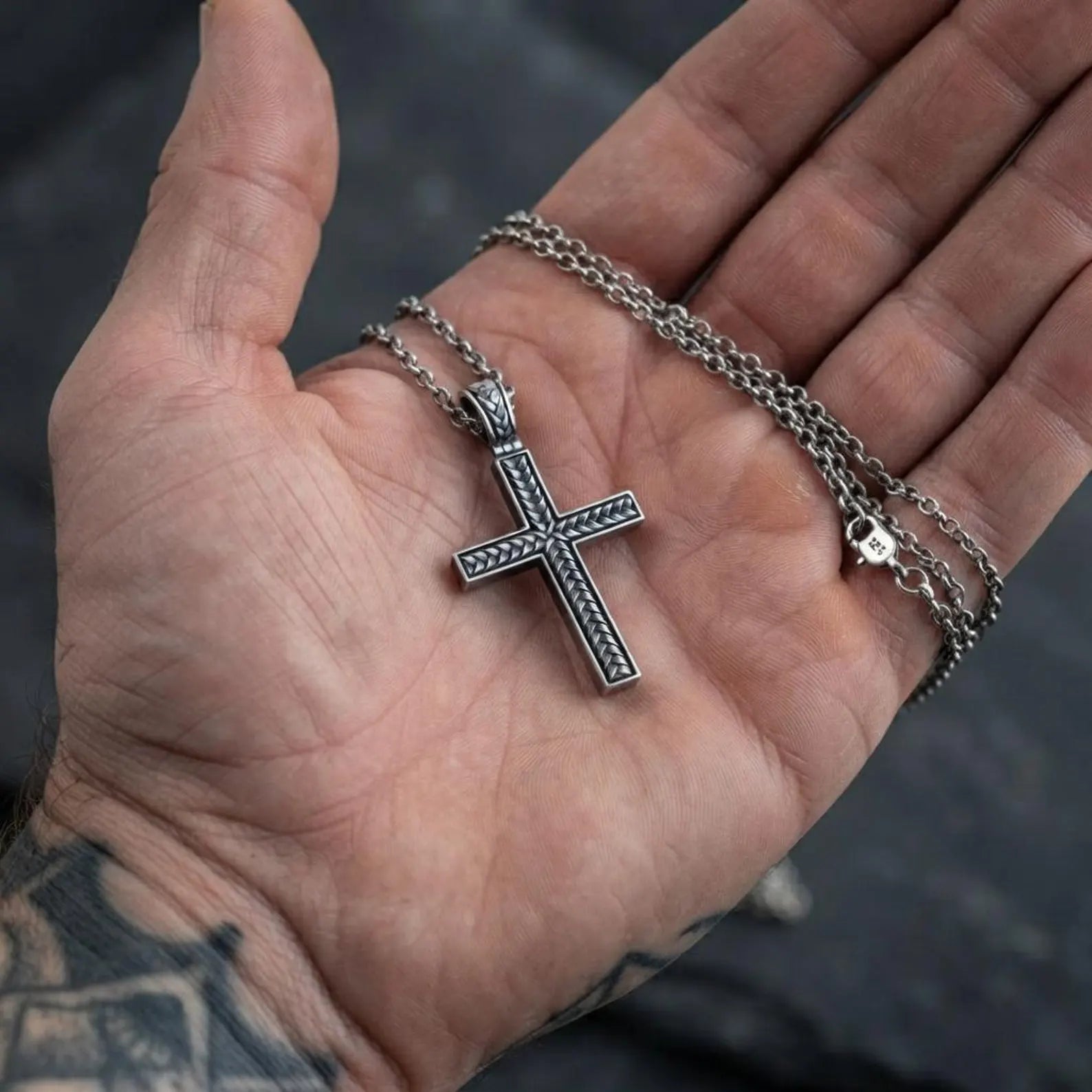 Unique sterling silver Christian cross necklace showcasing a handcrafted braided design, symbolizing hope, love, spiritual strength, and devotion through elegant artisan craftsmanship.