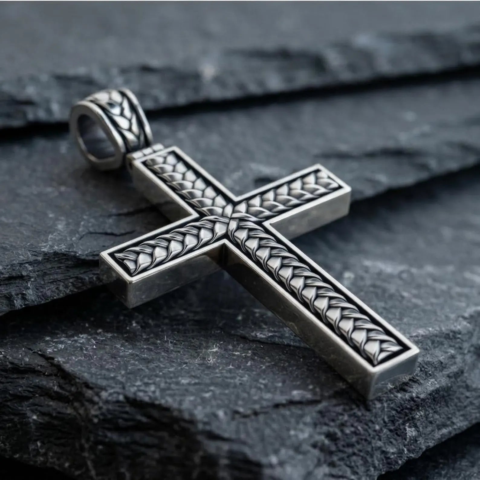 Sacred sterling silver braided cross pendant necklace with detailed handcrafted weaving, representing unity, faith, protection, and everlasting devotion in a refined Christian jewelry design.