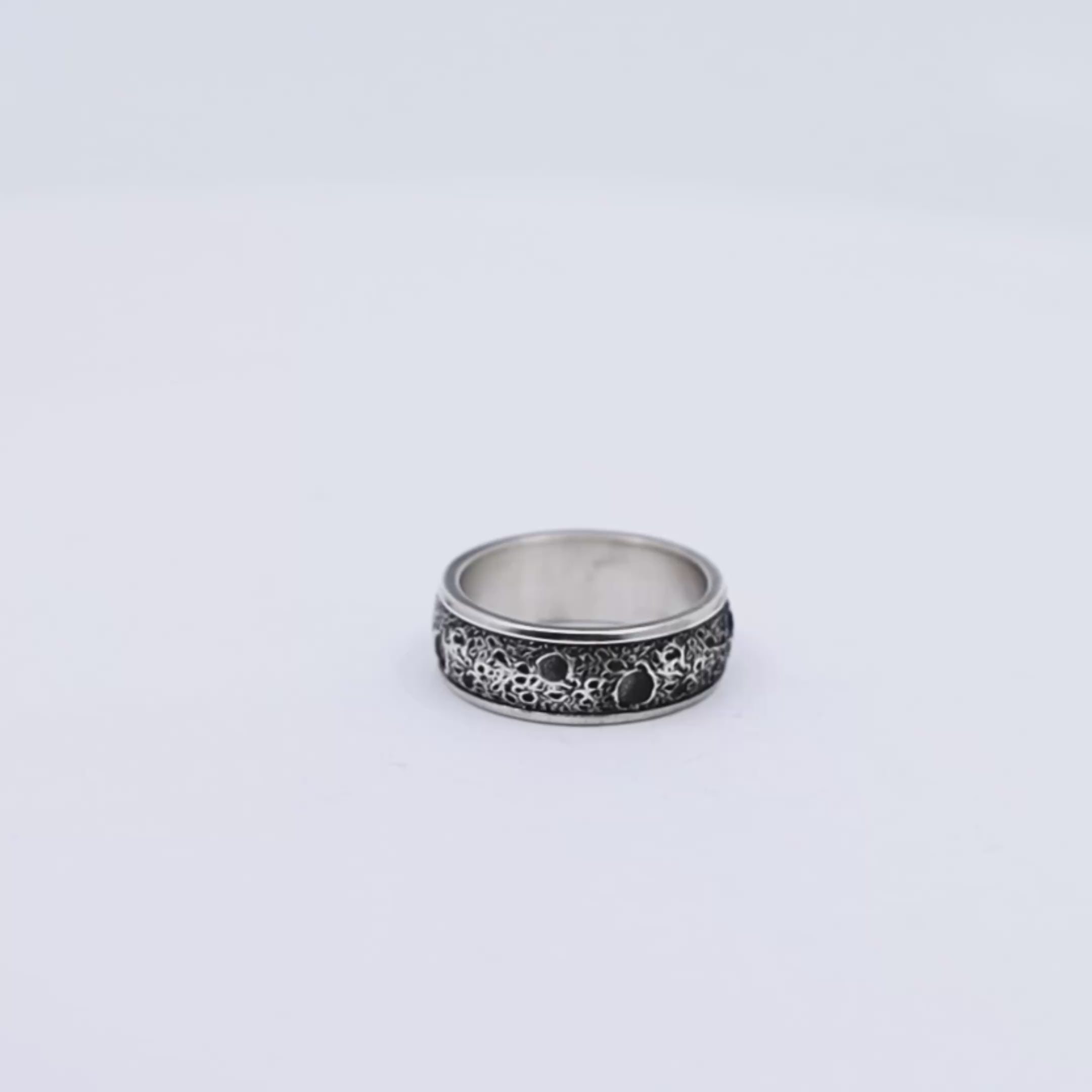 Handmade men’s silver band ring crafted in solid 925 sterling silver, showcasing a rugged, textured surface and clean edges, blending gothic inspiration with a timeless, minimalist design aesthetic.